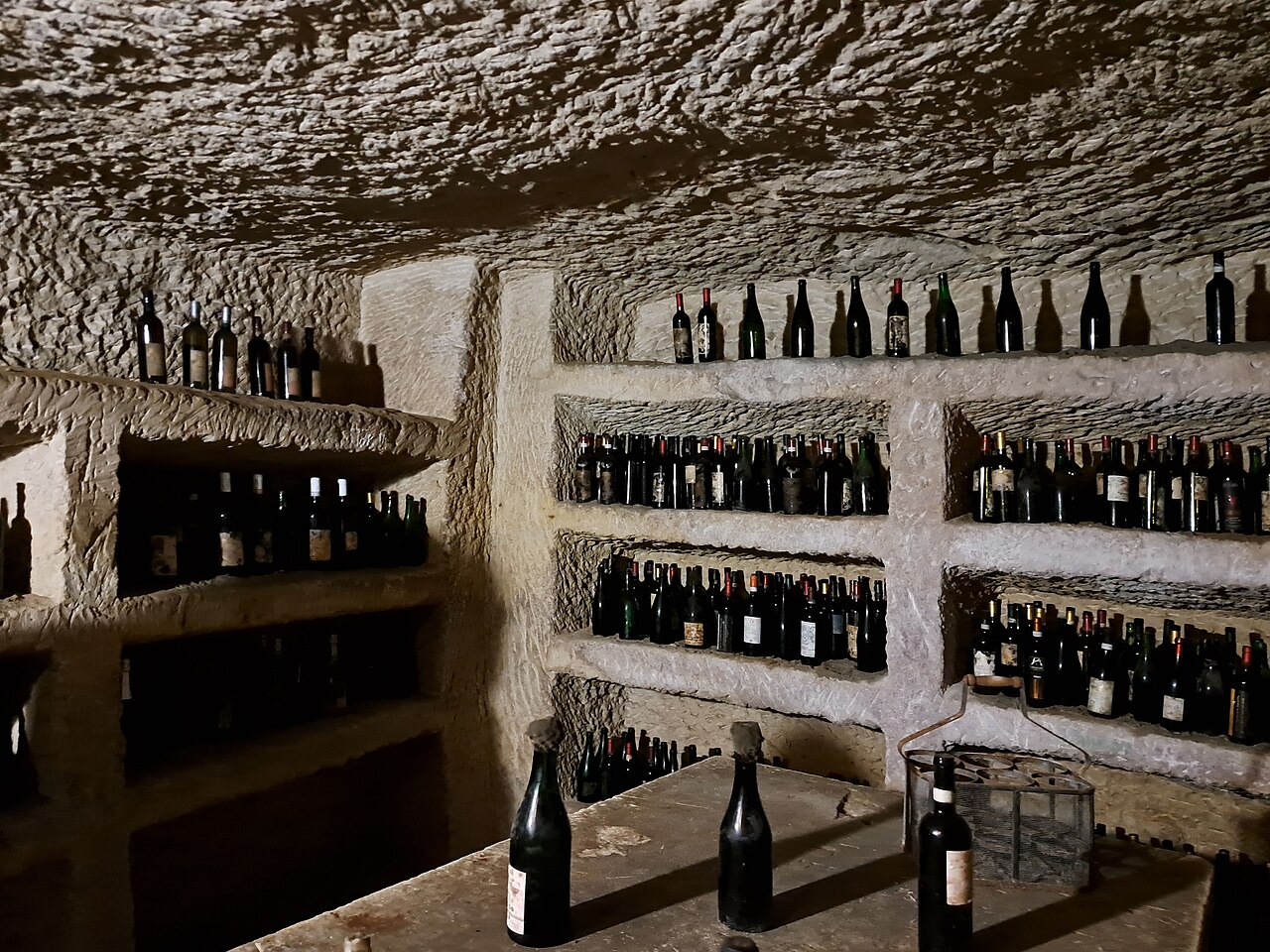 Bottles of wine in an old "Infernot" grotto