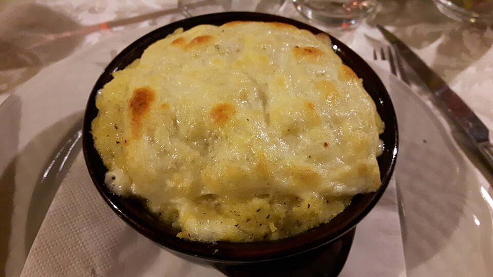 Polenta (boiled cornmeal) with cheese Aosta Valley style