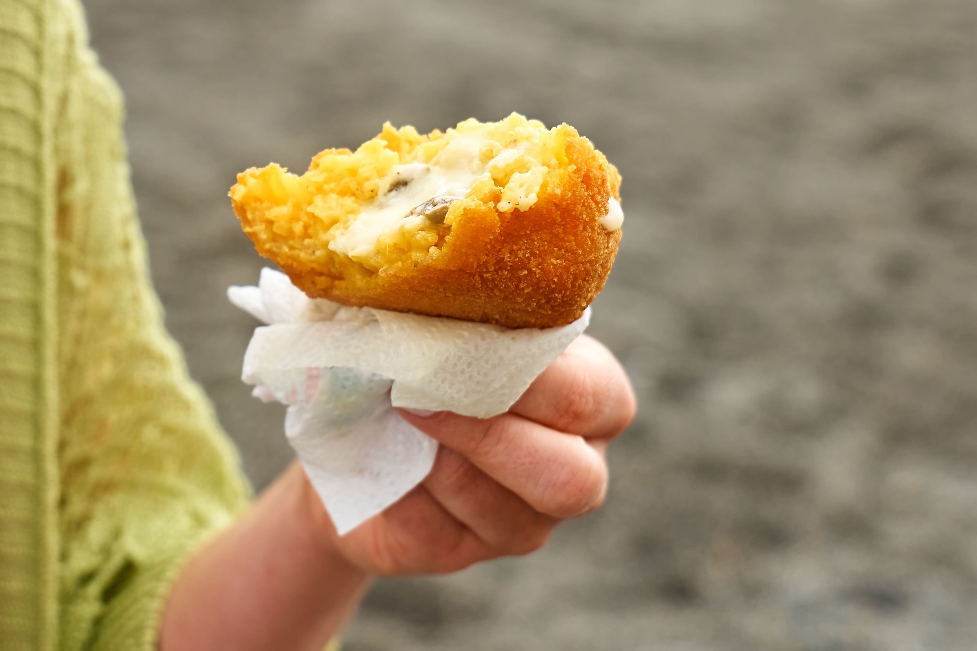 delicious-arancini-bite-held-comfortably-in-hand-2026